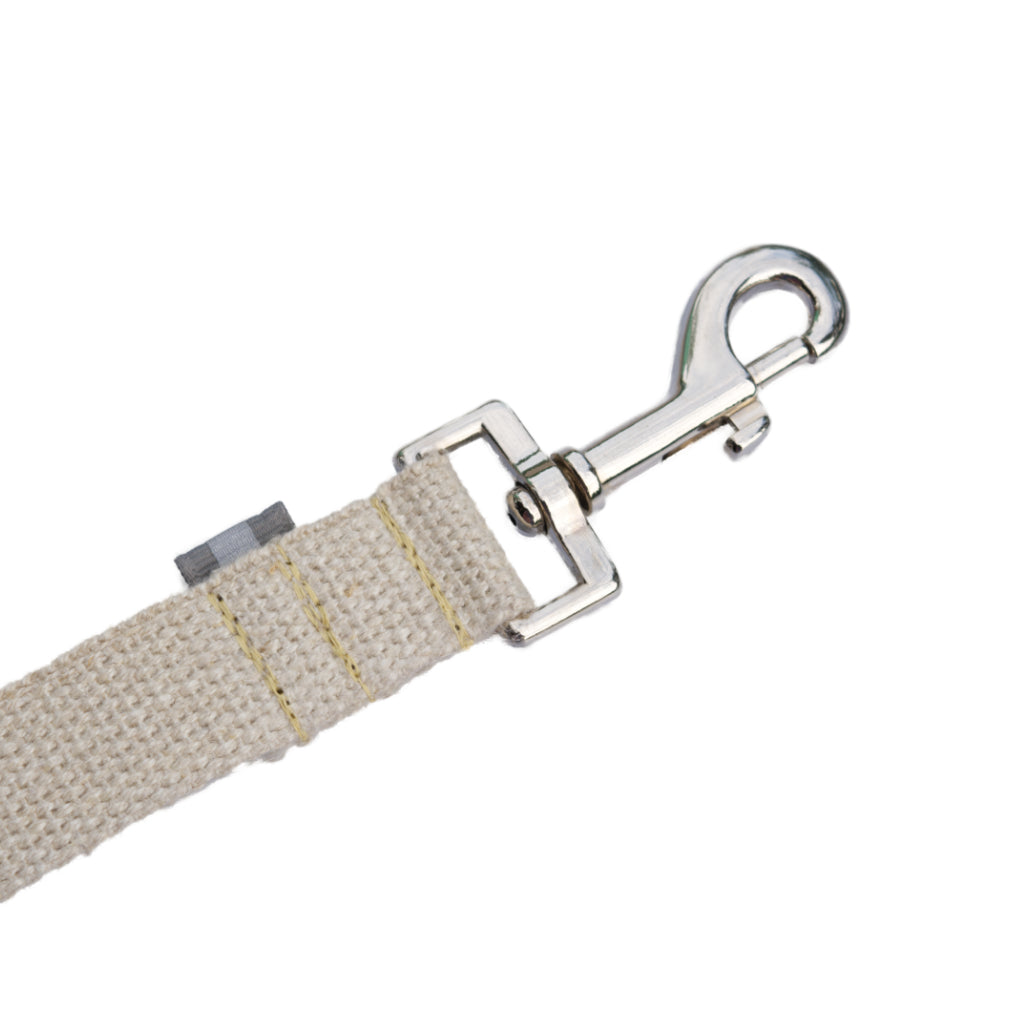 Tan undyed and nature hemp Canva leash splitter for dogs with grey reflective tabs at all ends, yellow kevlar stitching and shiny silver metal hardware. pictured with white backdrop.