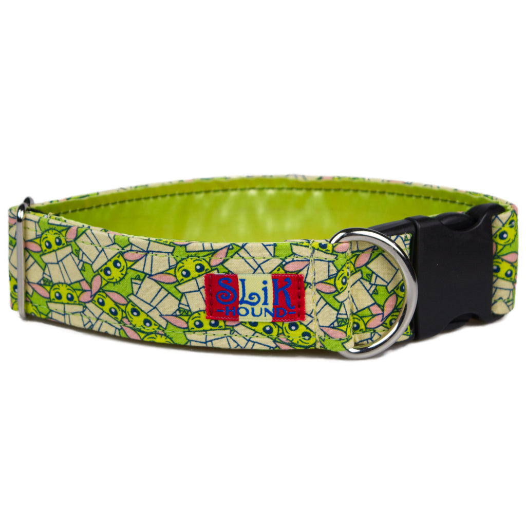 Bright lime green and tan baby Yoda cartoon design dog collar with shiny metal d ring  and black buckle. White background.