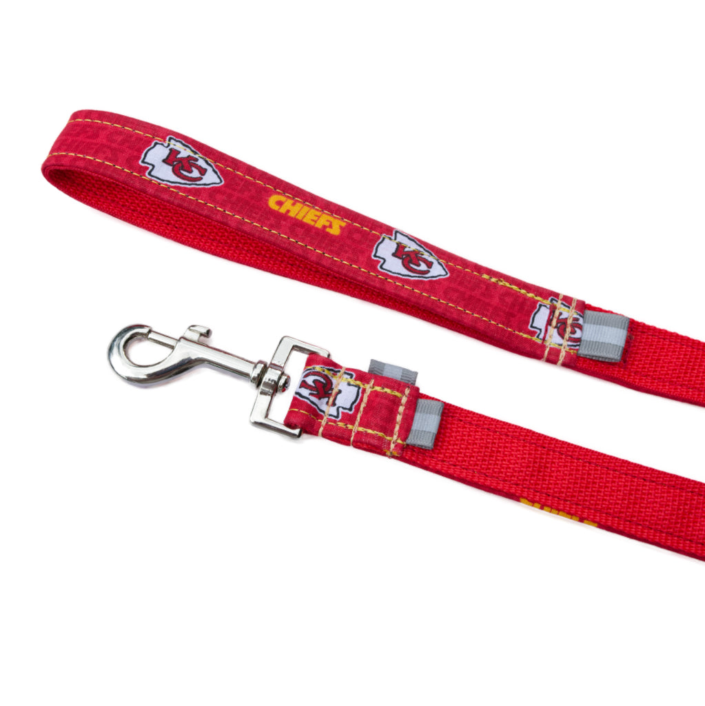 Bright red and gold Kansas City chiefs NFL themed leash with silver quick release snap hook and reflective tabs pictured with a white back drop.