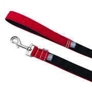 image of leash handle and leash hook of SLiK Hound dog leash positioned parallel  and turned upside down to showcase the black underside of the red dog leash. the black thread work is crisp and straight an the yellow kevlar stitching secures the handle and silver metal clasp. pictured against a white backdrop.